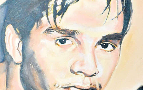 <p>Retrato. Esta pintura del boxeador adorna el local.</p>