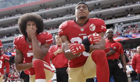 Kaepernick  y Reid zanjan demandas