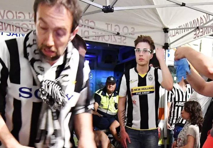 Aficionados lesionados. /Foto AP