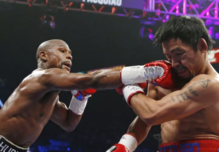 El estadounidense Floyd Mayweather (izq.) anunció que peleará por segunda ocasión con el filipino Manny Pacquiao. /Foto AP