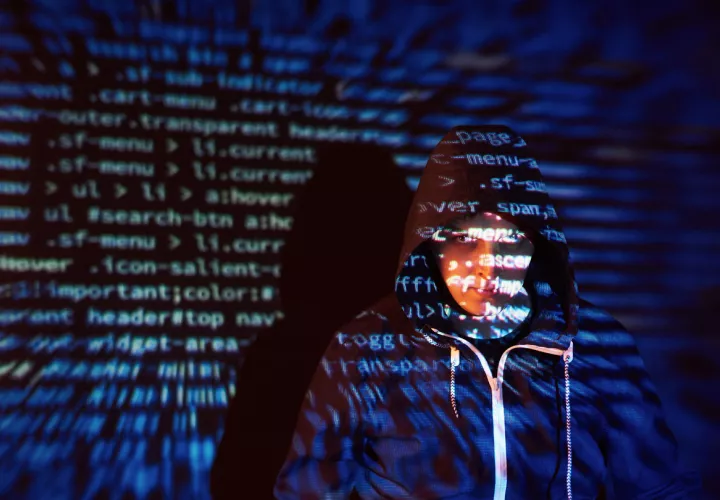 cyber-attack-with-unrecognizable-hooded-hacker-using-virtual-reality-digital-glitch-effect_.jpg