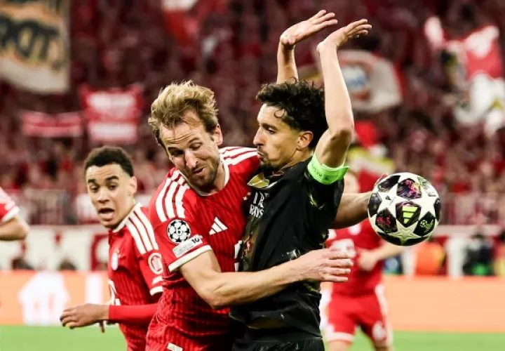Harry Kane, del Bayern, pelea el balón ante  Marquinhos, del PSG.  Foto: EFE