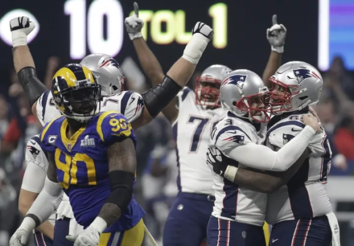 Jugadores de los Patriotas festejan. AP