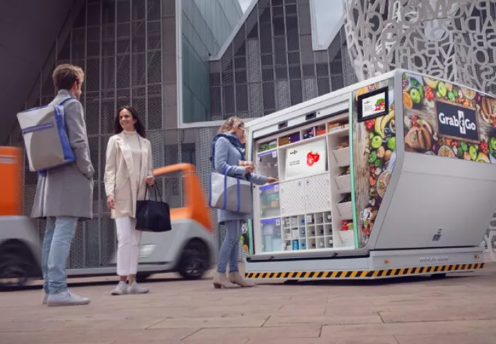 El prototipo modular MetroSnap, al fondo con una carga de paquetería ya puesta en la calle. 