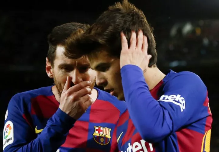 Messi y Ricard Puig. Foto:EFE