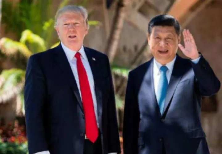 El presidente de EE.UU. Trump (izq.) y su homólogo Xi Jinping.